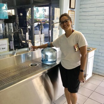Water Farm - a woman standing in front of a water cooler - Water Stores Near Me - Torrance, California Water Farm - a woman standing in front of a water cooler - Water Stores Near Me - Torrance, California