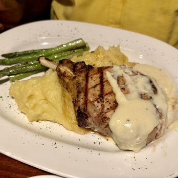 Middle Grounds Grill - Pork chop with parmesan cheese sauce - Seafood Near Me - Treasure Island, Florida Middle Grounds Grill - Pork chop with parmesan cheese sauce - Seafood Near Me - Treasure Island, Florida