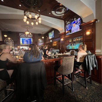 The Sticky Wicket - a group of people sitting at a bar - British Near Me - Victoria, British Columbia The Sticky Wicket - a group of people sitting at a bar - British Near Me - Victoria, British Columbia