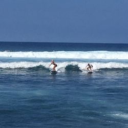 Mindbody Surf and Yoga School - Hawaii - Take 2! ... releasing your hands is second step .... with Lindsay , surf instructor (on left ) last week !