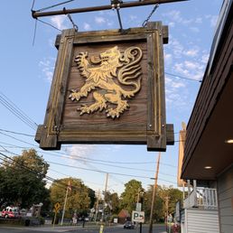 a lion on a wooden sign a lion on a wooden sign