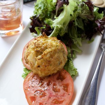Hunters' Tavern - Crab cake "sandwich" on a bed of leafy greens with a "side salad" which consisted of only lettuce. - American Near Me - Easton, Maryland Hunters' Tavern - Crab cake "sandwich" on a bed of leafy greens with a "side salad" which consisted of only lettuce. - American Near Me - Easton, Maryland