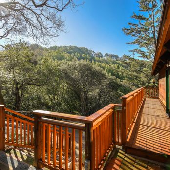 Nery's Elite Carpenters & Construction - a deck overlooking the trees - General Contractors Near Me