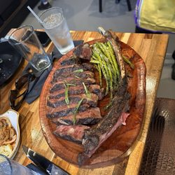 Cork & Cleaver Steakhouse - Tomahawk steak.