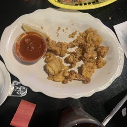 Captain John's Dockside - The calamari appetizer after we started to eat the appetizer.