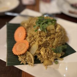 Patsara Thai Restaurant - PINEAPPLE FRIED RICE Jasmine rice stir fried with pineapples, onions, egg and curry powder. This dish contains oyster sauce.