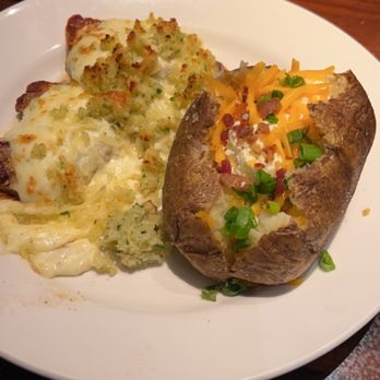 LongHorn Steakhouse - Parmesan Crusted Chicken with loaded baked potato. - Steakhouses Near Me - Fort Wayne, Indiana LongHorn Steakhouse - Parmesan Crusted Chicken with loaded baked potato. - Steakhouses Near Me - Fort Wayne, Indiana