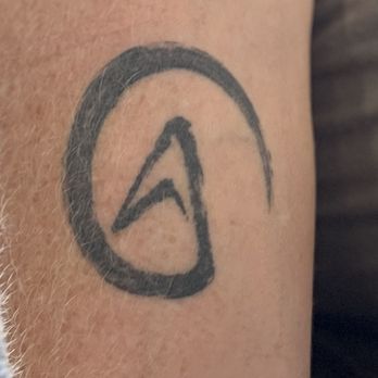 Jane's Ink - This is my first tattoo. It's a generic Atheist tattoo. I asked Tian to make it "kinda sketchy, like someone just drew it casually". - Tattoo Near Me - Upland, California