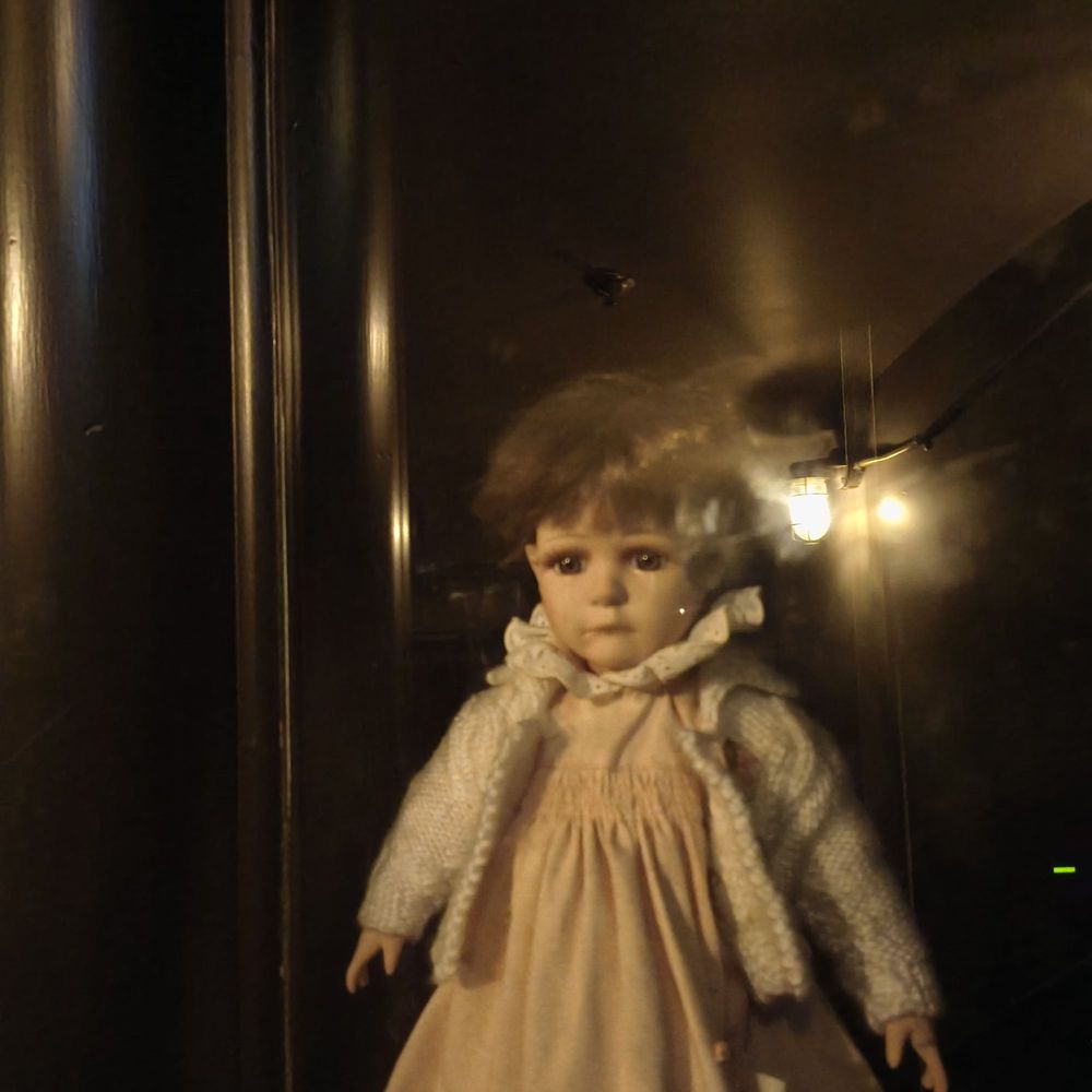 Hanny's - Doll in a niche in the stairs - Lounges Near Me - Phoenix, Arizona
