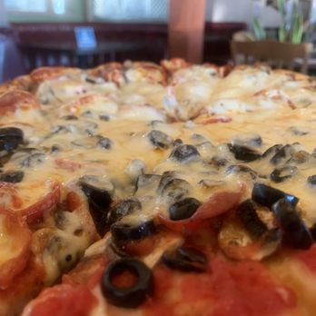 Chi Chi's Pizza - Half pepperoni sausage and mushroom and other half is pepperoni mushrooms and olives - Pizza Near Me - Northridge, California Chi Chi's Pizza - Half pepperoni sausage and mushroom and other half is pepperoni mushrooms and olives - Pizza Near Me - Northridge, California