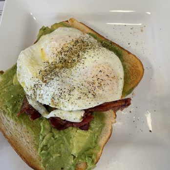 Uptown Grill - an avocado toast with an egg on top - American Near Me - Bay City, Michigan Uptown Grill - an avocado toast with an egg on top - American Near Me - Bay City, Michigan