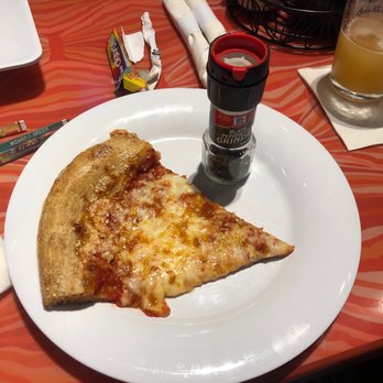 Mellow Mushroom - One of six slices from our medium pizza. Shaker for size comparison. - Bars Near Me - Branson, Missouri