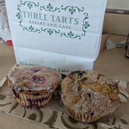 A lemon raspberry muffin and a blueberry muffin.