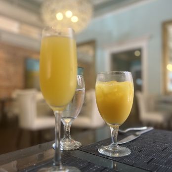 Hamptons - two glasses of orange juice on a table - Wine Bars Near Me - Sumter, South Carolina Hamptons - two glasses of orange juice on a table - Wine Bars Near Me - Sumter, South Carolina