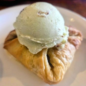 Sage Creek Grille - Poached spiced pear pastry with sage pecan ice cream - American Near Me - Custer, South Dakota