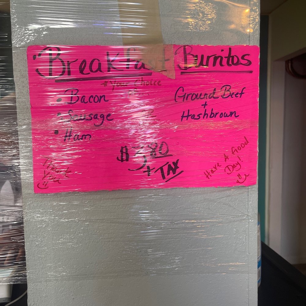 a pink sign on a refrigerator a pink sign on a refrigerator