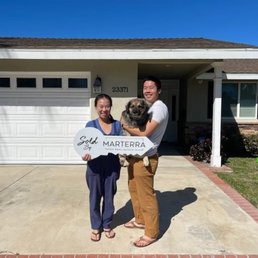 At our new home with our dog! Who is in love with Christine.