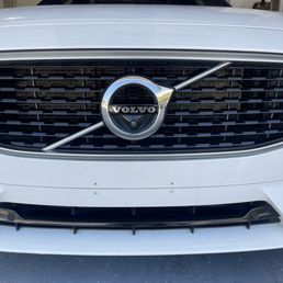 Before: Unsightly dealership-drilled license plate holes