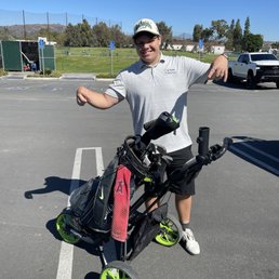 My nephew Diego trying out his new golf cart ! Brea Creek driving range in back. My nephew Diego trying out his new golf cart ! Brea Creek driving range in back.
