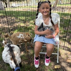 A party go-er with some of our petting zoo critters!