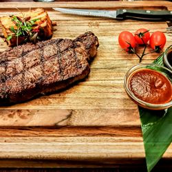 The Choice - New York Steak: Prime 10 OZ Served with potato au gratin, spicy Peruvian and teriyaki sauces on the side. $40