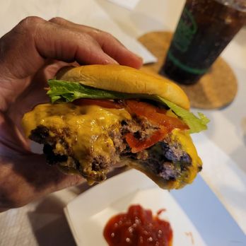 Shake Shack - It took 3 bites to get to the bun of this delicious Double Shack Burger! The perfectly mixed Coke Zero was waiting in the background. - Ice Cream & Frozen Yogurt Near Me - Hillsboro, Oregon