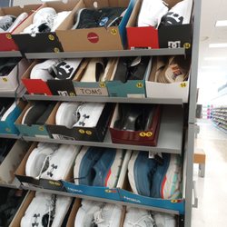 Marshalls 713 - They have sizes 14-15 men's shoes.  I even saw a few pairs of size 16. Very rare to see these sizes outside of specialty stores.