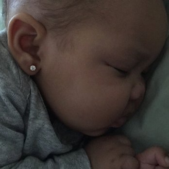 Charlotte's Ear Piercing Service - Pierced with 24 karat gold. - Piercing Near Me