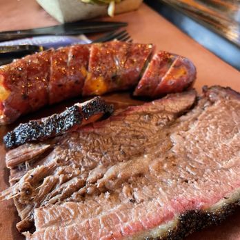 Evie Mae's Pit Barbecue - Brisket & Green Chile & Cheddar Sausage with collared greens - Barbeque Near Me - Wolfforth, Texas Evie Mae's Pit Barbecue - Brisket & Green Chile & Cheddar Sausage with collared greens - Barbeque Near Me - Wolfforth, Texas