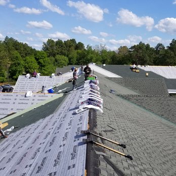 BGC Expert Contractors - a roofer working on a roof - Roofing Near Me - Raleigh, North Carolina