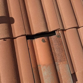 Monarch Roofing - More shifted tiles that caused our roofing leaks that got into the ceiling drywall. - Roofing Near Me - Orange, California