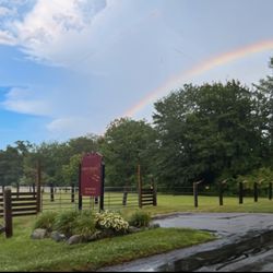 Saddle Brook Farm - Rainbow over the sign.