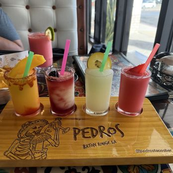Pedro's Tacos And Tequila - Margarita flight. From right to left flavors: strawberry, regular lime margarita, sangria, and mango - Mexican Near Me - Baton Rouge, Louisiana