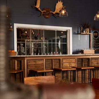 Blue Rascal Distillery - a bar with wooden stools - Distilleries Near Me - Hammonton, New Jersey