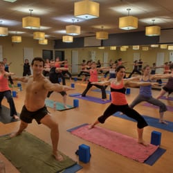 Southern Om Hot Yoga - Southern Flow moves through Warrior II