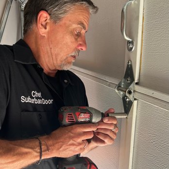 Suburban Garage Door - Installing new hinges on insulated garage door. - Garage Door Services Near Me - Allen, Texas Suburban Garage Door - Installing new hinges on insulated garage door. - Garage Door Services Near Me - Allen, Texas