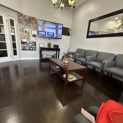 Cosmetic and Dental Implant Center - Small waiting area. Comfortable chairs and
