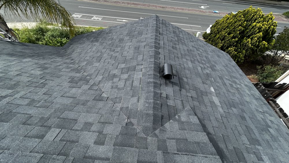 Slide of J&E Roofing Services