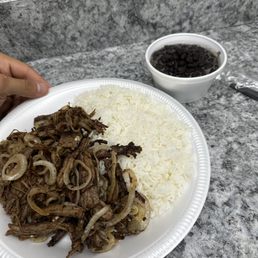 a plate of shredded beef with rice and beans a plate of shredded beef with rice and beans
