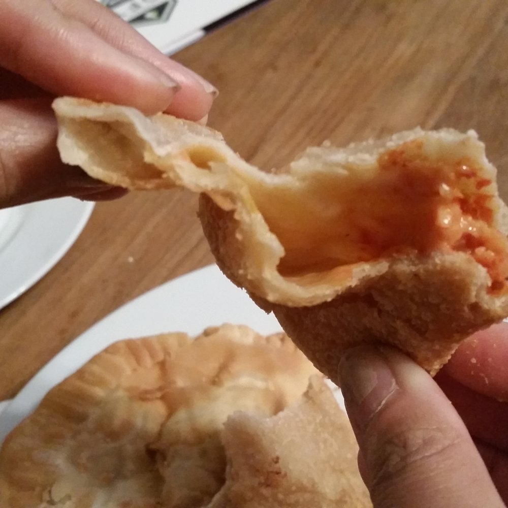 Pizza empanada lacked a decent amount of filling. See my review: http://goo.gl/CITkCz Pizza empanada lacked a decent amount of filling. See my review: http://goo.gl/CITkCz