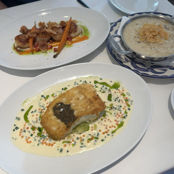 LUCA - Entrees - Sea Scallops, Potato Crusted Halibut, and side order of Truffle Butter & Parmesan Risotto - Italian Near Me - Stony Brook, New York LUCA - Entrees - Sea Scallops, Potato Crusted Halibut, and side order of Truffle Butter & Parmesan Risotto - Italian Near Me - Stony Brook, New York