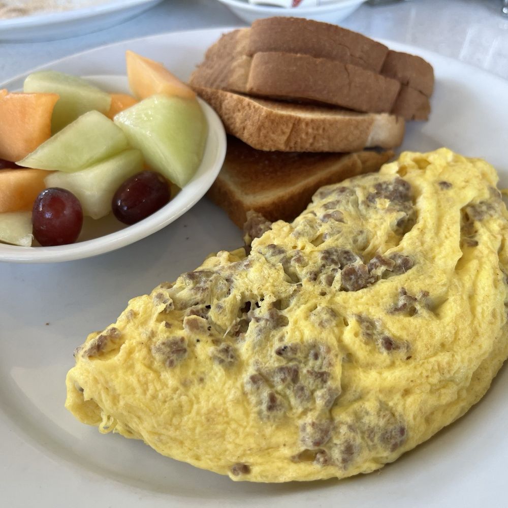 Peach Valley Cafe - A Valley Omelet with sausage, fruit (instead of potatoes, and) and toast before I slather the pepper sauce on. - Breakfast & Brunch Near Me - Maitland, Florida Peach Valley Cafe - A Valley Omelet with sausage, fruit (instead of potatoes, and) and toast before I slather the pepper sauce on. - Breakfast & Brunch Near Me - Maitland, Florida