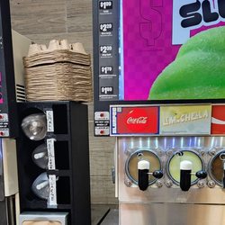 7-Eleven - 2 coke slurpee tanks. My kind of place