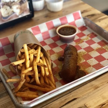 Legacy Hall - Currywurst (veggie sausage) topped with German Dipping Sauce & Seasoned Fries - Food Court Near Me - Plano, Texas