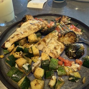 California Fish Grill - Sea bass with garlic butter sauce. The sides were rosemary zucchini & Brussels sprouts. - Seafood Near Me - Phoenix, Arizona California Fish Grill - Sea bass with garlic butter sauce. The sides were rosemary zucchini & Brussels sprouts. - Seafood Near Me - Phoenix, Arizona
