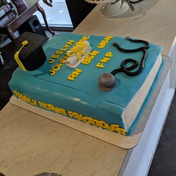Jennivee’s Bakery - Custom graduation cake. The lettering is off on the side of the book - Desserts Near Me - Chicago, Illinois