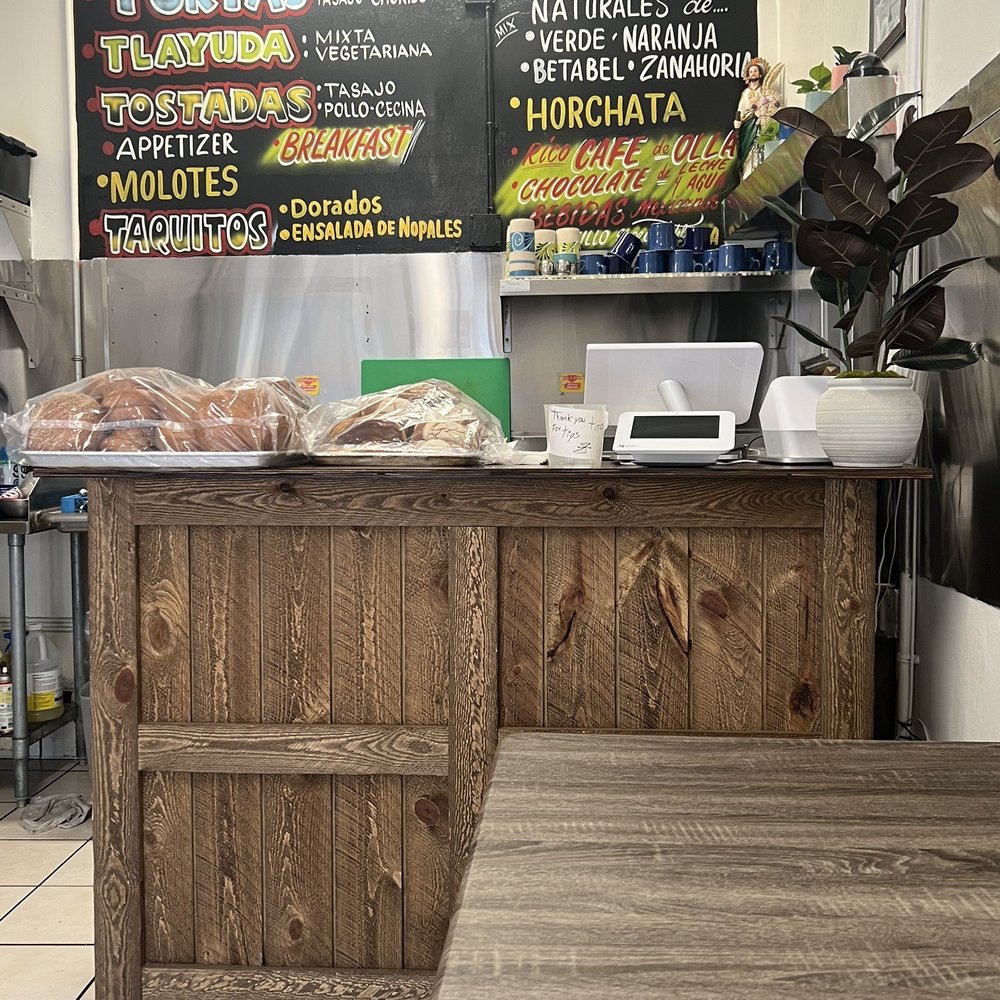 Y Porque No - a restaurant counter with a menu on the wall - Mexican Near Me - Los Angeles, California Y Porque No - a restaurant counter with a menu on the wall - Mexican Near Me - Los Angeles, California