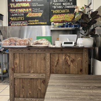 Y Porque No - a restaurant counter with a menu on the wall - Mexican Near Me - Los Angeles, California Y Porque No - a restaurant counter with a menu on the wall - Mexican Near Me - Los Angeles, California