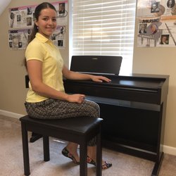 Olga's Piano Studio - One of Yamaha's best electronic pianos is used at Olga's studio along with other materials that help students visualize musical timeline.