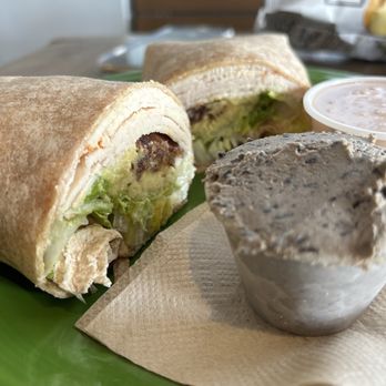 Delicomb - T-bam wrap--the black bean hummus on the side - Coffee & Tea Near Me - Jacksonville Beach, Florida